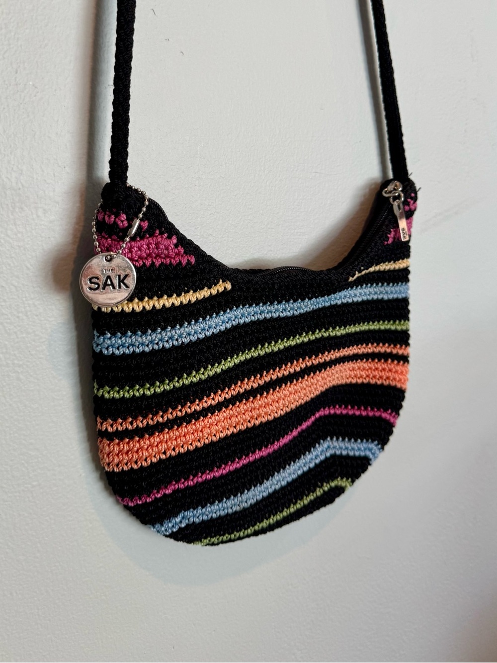The Sak Black Crochet Crossbody with Pink, Orange, Blue and Green Stripes
